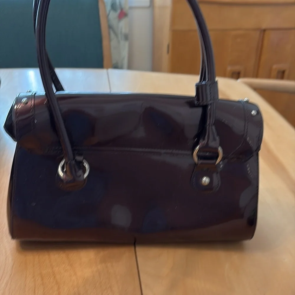 Beijo dark brown patent leather shoulder bag with magnetic close.